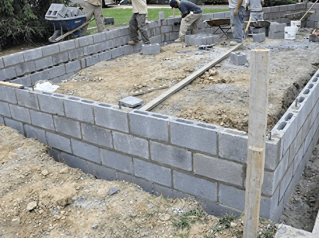 Professionals building a foundation with blocks in Colorado Springs, CO