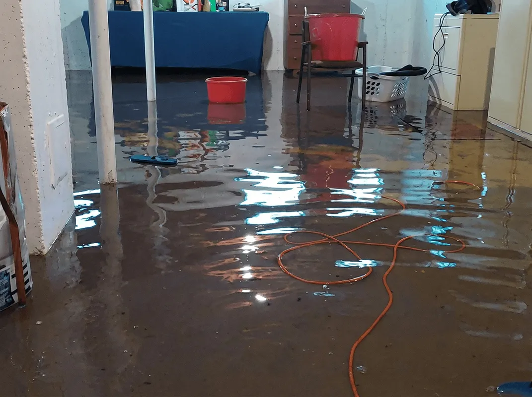 Basement with boiler, cabinets and washing machine completely flooded in Colorado Springs, CO